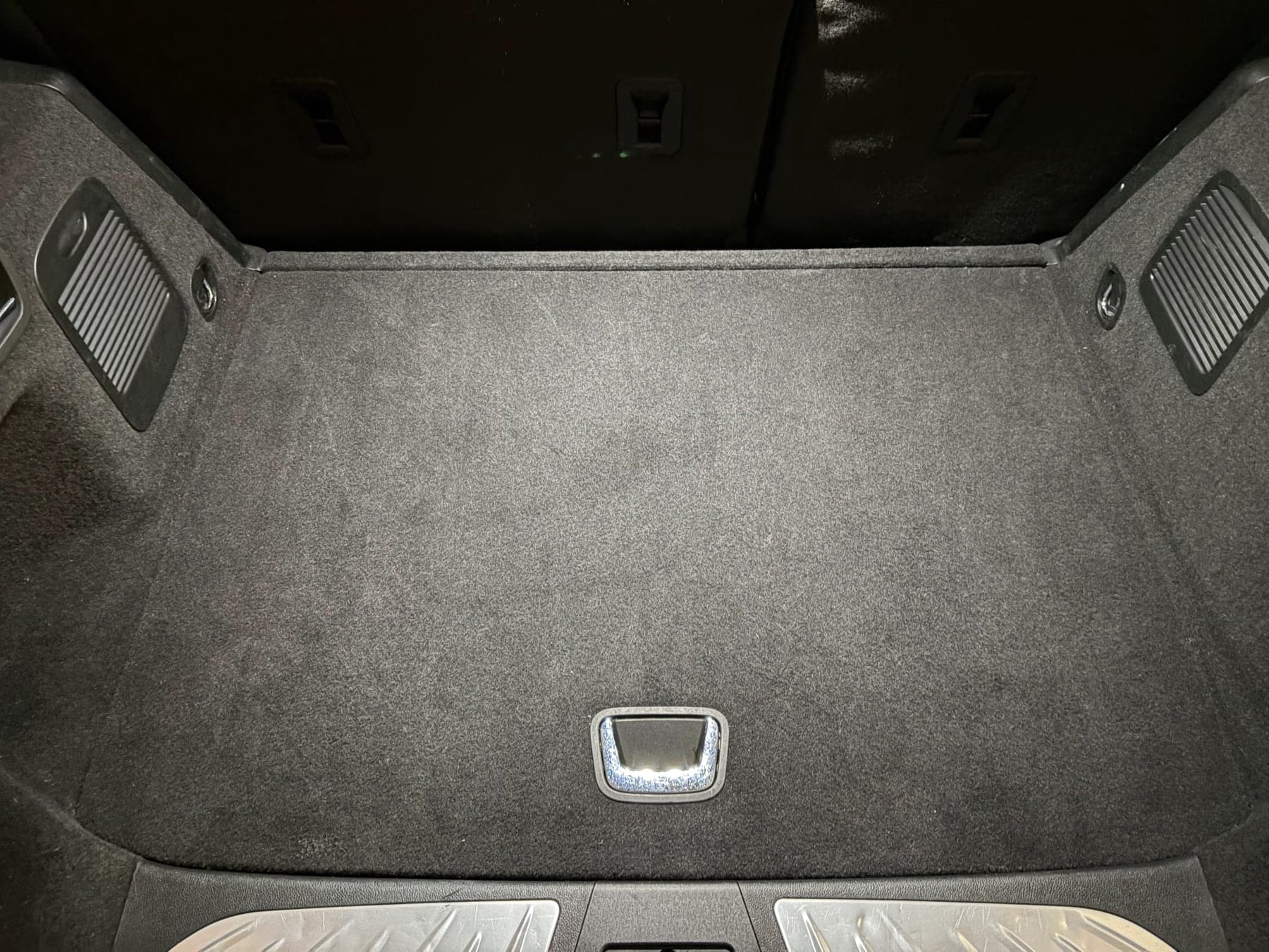 SUV cargo area carpet vacuumed and cleaned