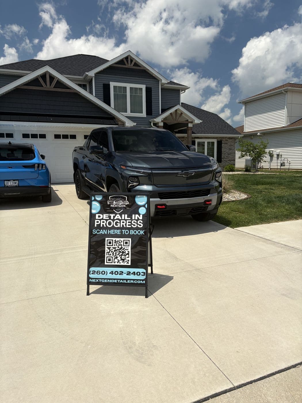 Black Chevy truck detail in progress at a customer home
